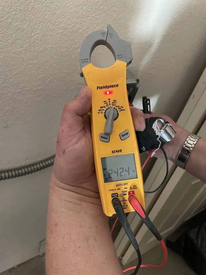 Voltage testing with clamp meter during Generator Installation in Lake Mary